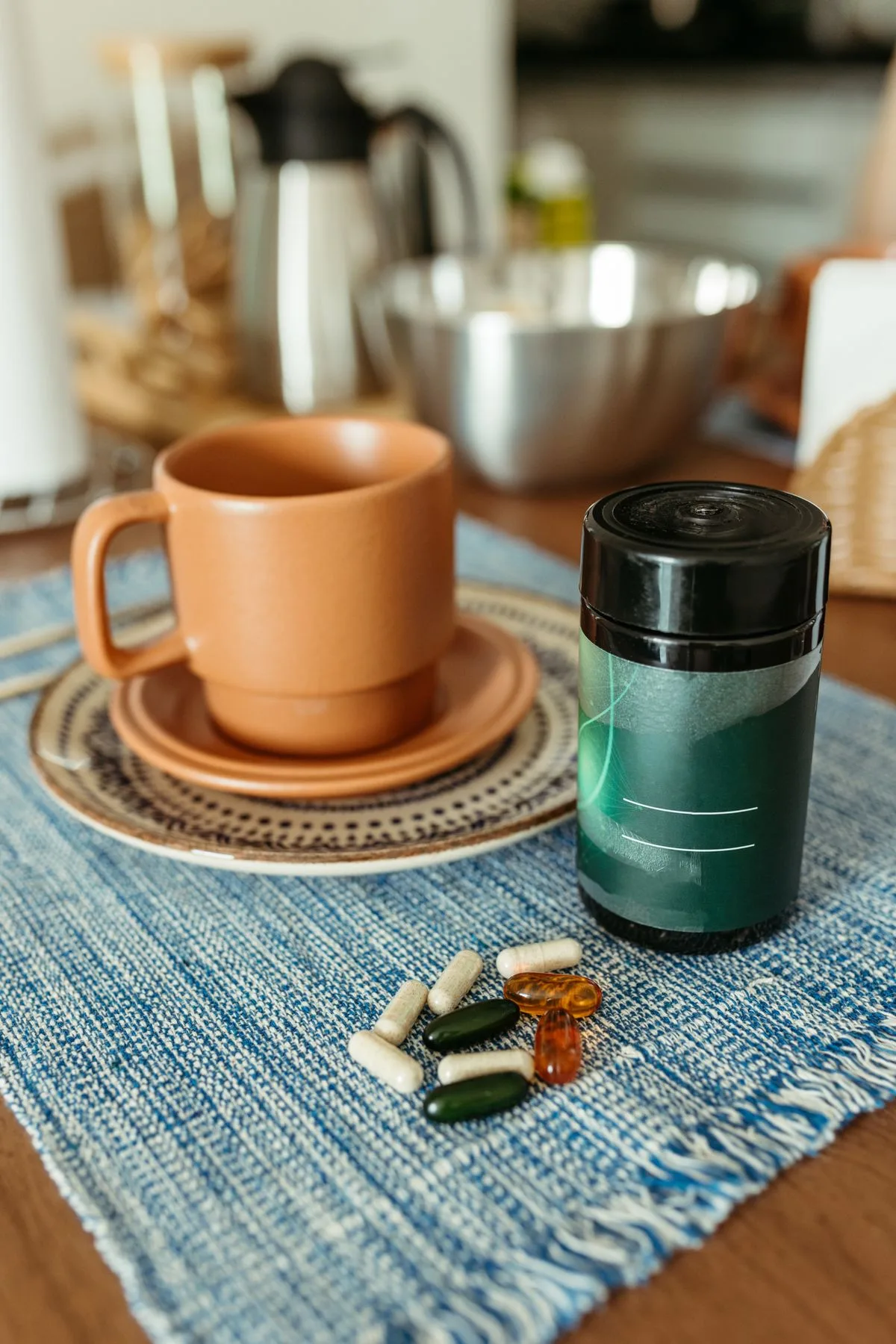 Cozy kitchen scene featuring vitamins and a cup on a wooden table, morning health routine
