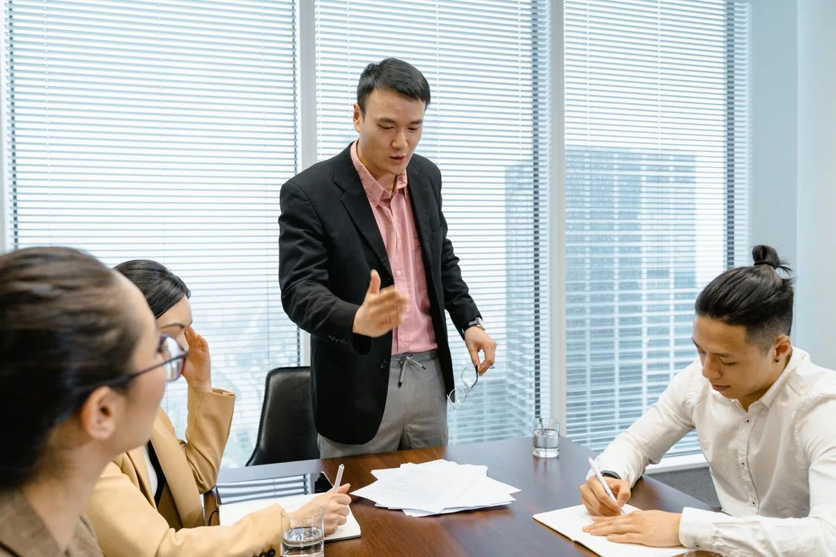 Business professionals in corporate meeting — adapting chronotype to fixed work schedule